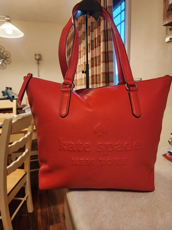This Kate Spade Larchmont Avenue Logo Penny Tote in chili red
