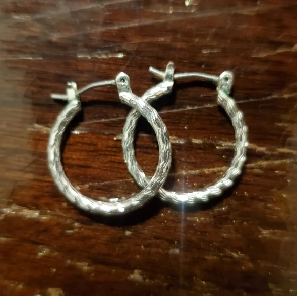 Silver-colored small 3/4 inch diameter textured hoop earrings