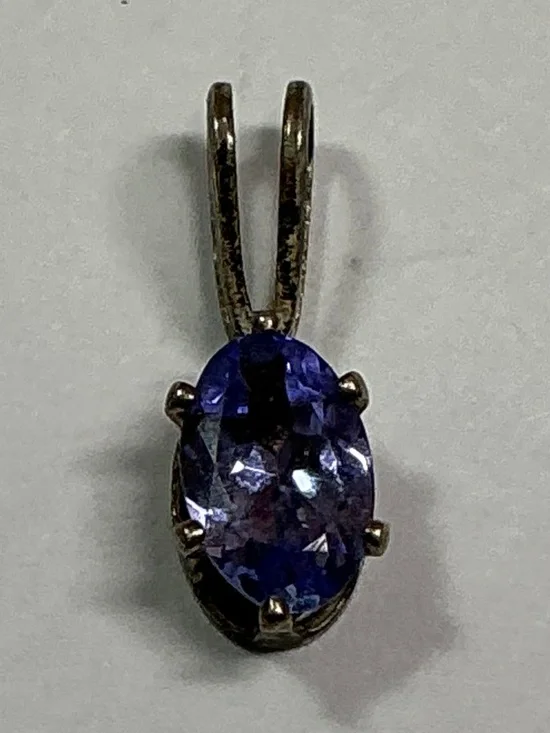 Sterling Silver Petite Blue Oval Shape Pendant. 1/2 inches long