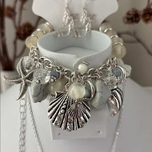 Laura Ford Seashells,Mermaid,Starfish, Silvertone earring & stretch bracelet set