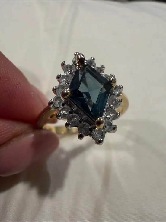 18K Gold Electroplated Ring with Deep Blue Kite-Cut Center and Clear Stones.