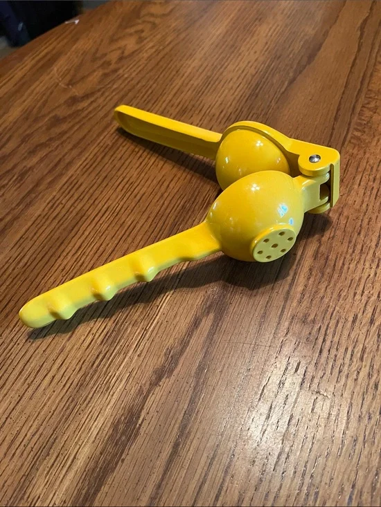 Bright yellow lemon juicer