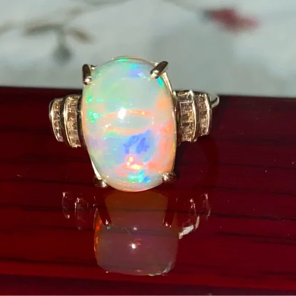 AAA Ethiopian Welo 7.56 cwt Opal and G-H SI Diamond Ring in 10 k gold size 7