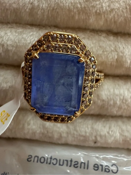 Heartbreaker’s Halo Gold Cocktail Ring with Deep Blue Center Stone