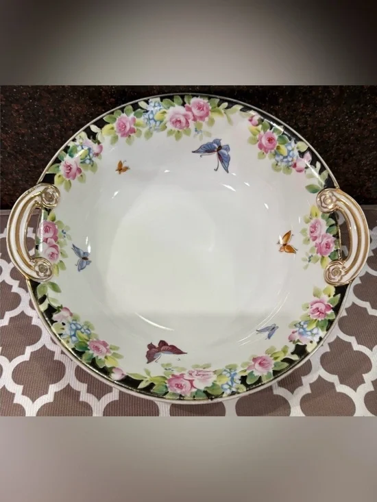 Nippon Hand-painted bowl featuring a floral motif & butterflies with gold trim