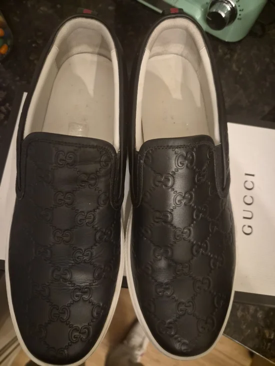 Gucci Black Embossed GG Leather Slip-On Sneakers with White Sole