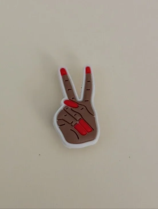 10 for $10 Jibbitz Croc Charm - Red Nails On Woman's Hand In Peace Sign Symbol
