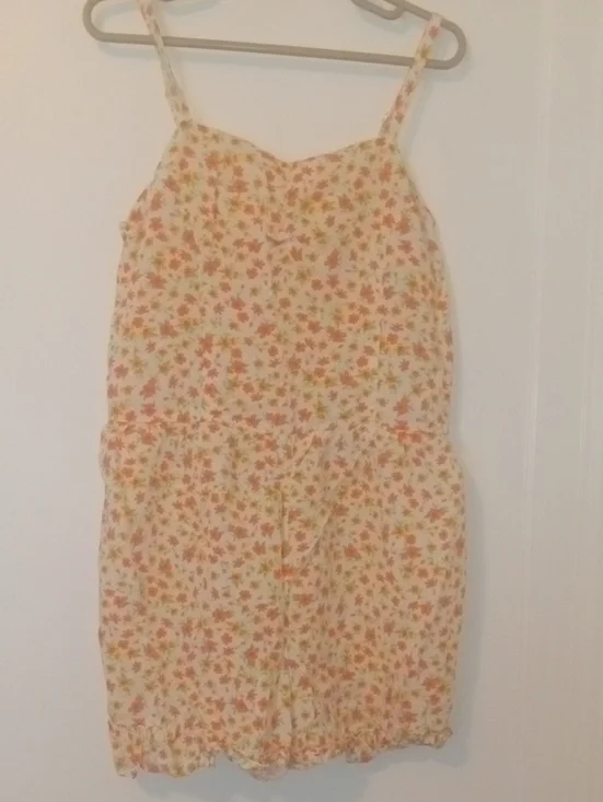 girl med bright flower print short romper