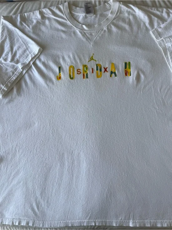 Vintage Jordan White Tee with Multicolor Lettering and Gold Jumpman