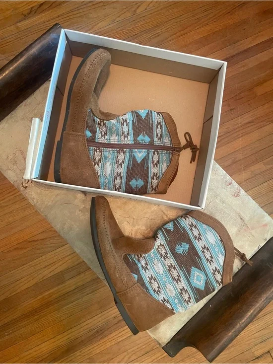 Brand new Minnetonka Baja Boots!