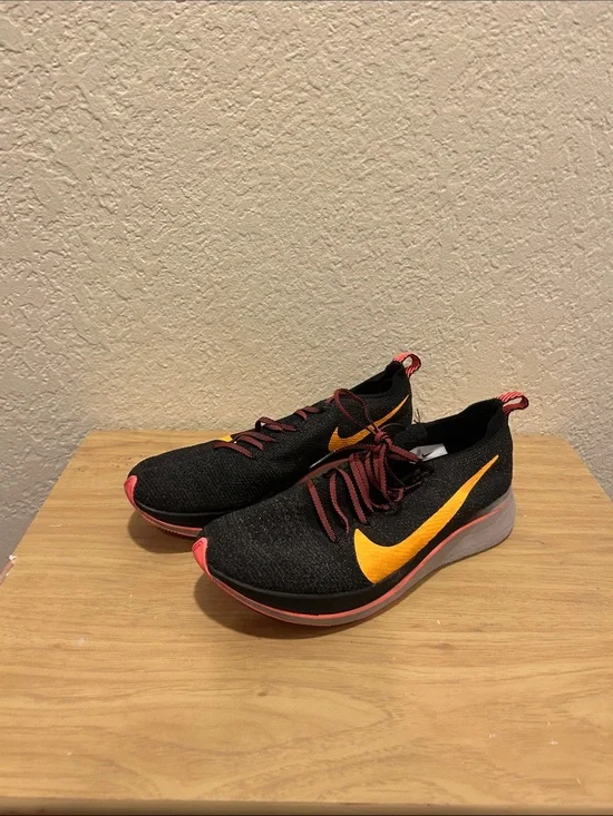 Nike Black Running Sneakers with Yellow Swoosh and Coral Accents
