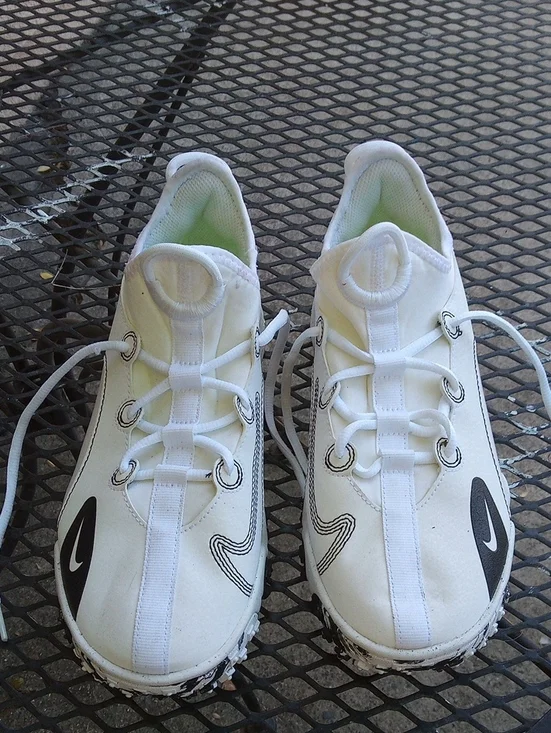 Nike White Sneakers with Black Swoosh Accents