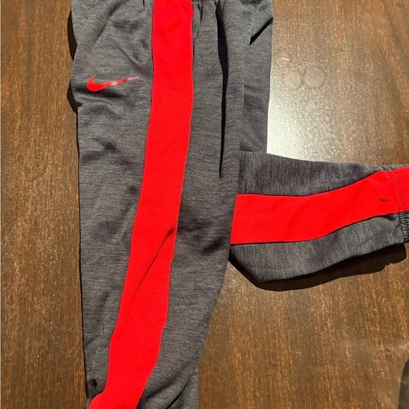 Nike Kids Charcoal Gray Joggers with Red Stripe