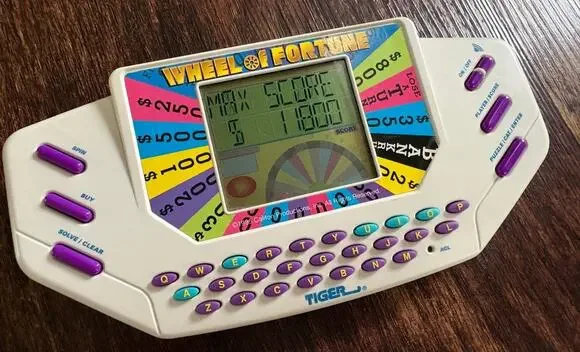1995 Tiger Electronics Wheel Of Fortune Handheld LCD Video Game Plus Cartridge 1