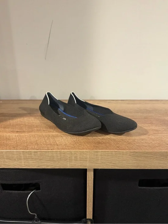 Rothy's Black Slip-On Flats with White Trim