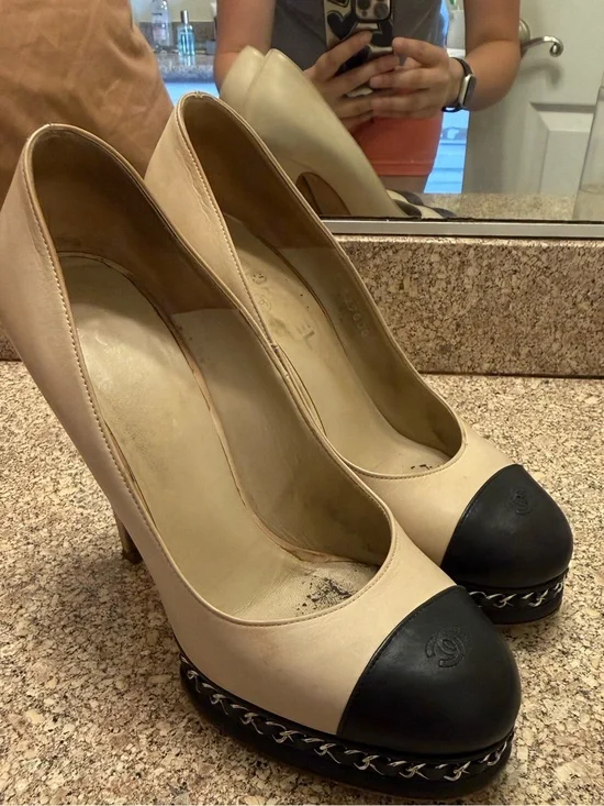 CHANEL Beige Leather Platform Pumps with Black Cap Toe and Chain Trim