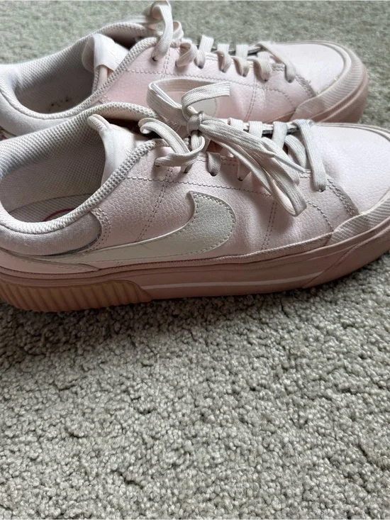 Nike Women’s Light Pink Low-Top Sneakers with White Swoosh