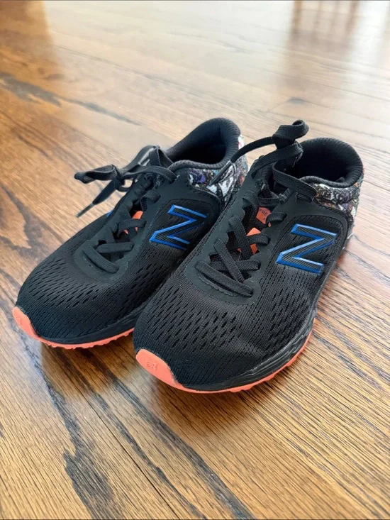 E New Balance Kids 13 Black Sneakers with Blue N Logo and Coral Accents