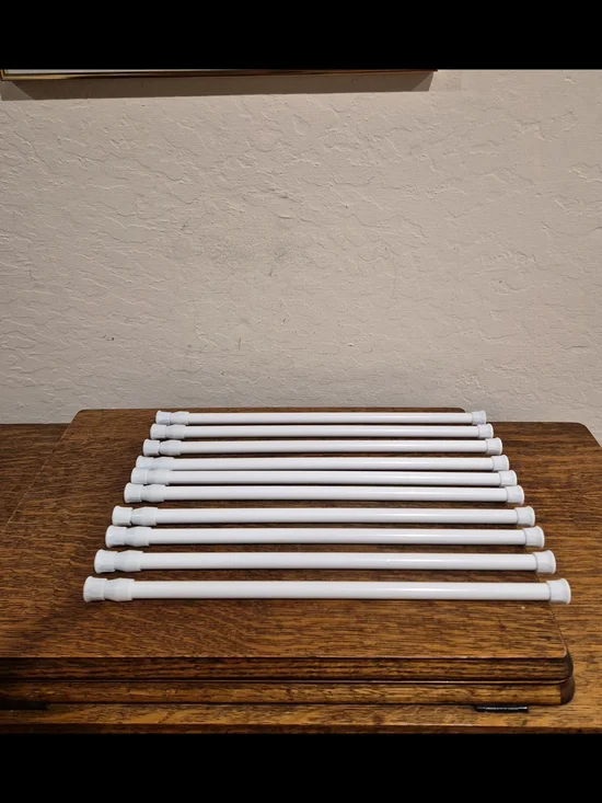 Set of 10 White Adjustable Spring Tension Curtain rods. 16
