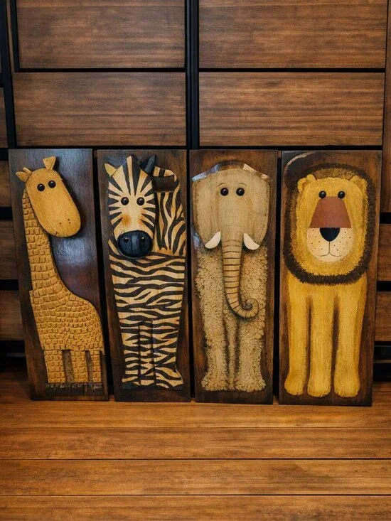 Metal wall art set featuring giraffe, zebra, lion and elephant