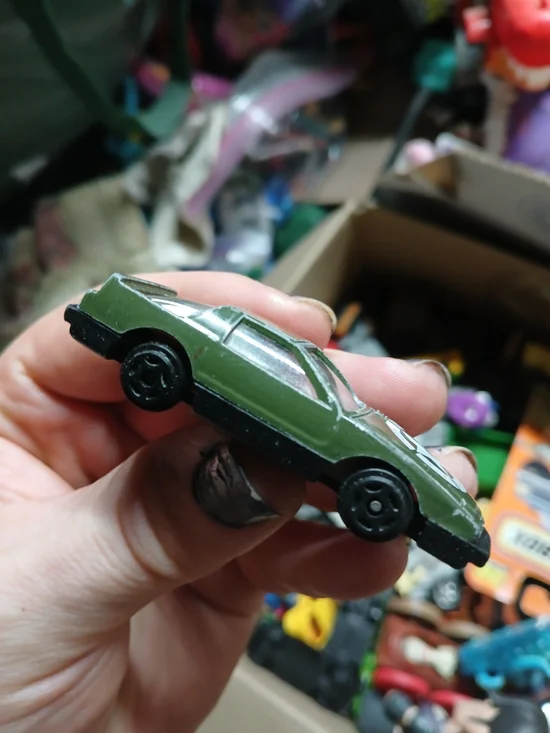 1:64 scale Pontiac Firebird Trans Am die-cast car  an army green 