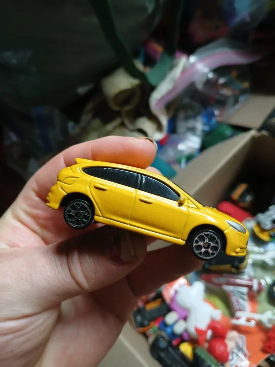 yellow 1:64 scale Maisto Ford Focus ST die-cast toy car