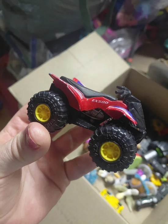 a Greenbrier International EX500 3-inch die-cast red quad ATV toy,