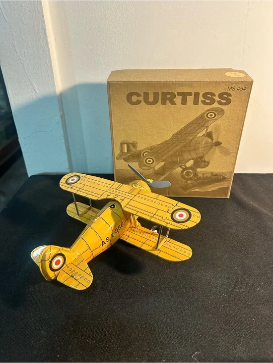 Yellow Biplane Tin Toy - collectible wind up