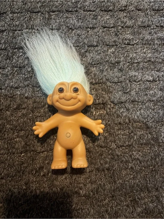 Russ treasure troll with sky blue hair.