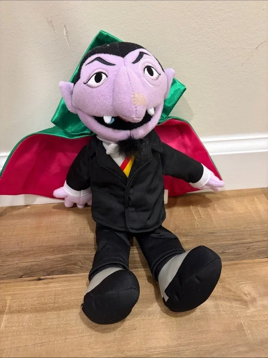 Sesame Street Plush with Black Body and Bright Pink Cape