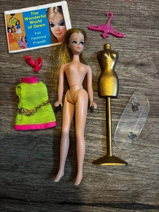 Topper Dawn Fancy Feet doll wearing lime green and pink hard straight legs