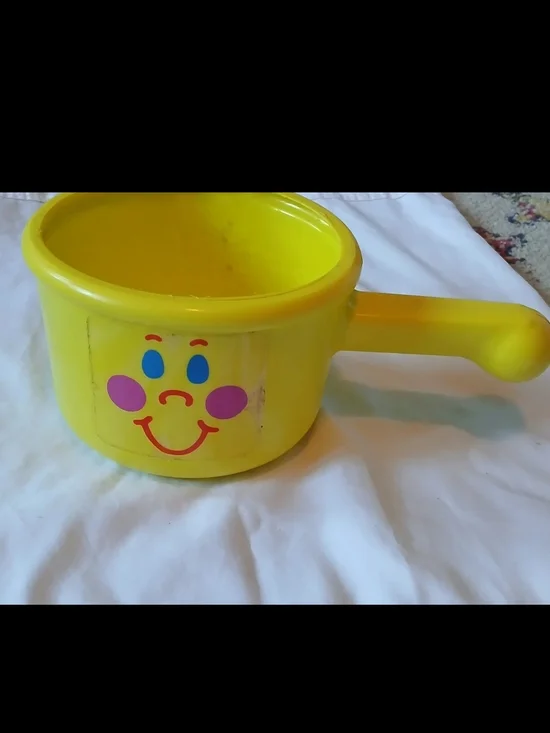 The First Years Yellow Smiley Toy Cooking Pot with Handle for Ages 12-18 Months