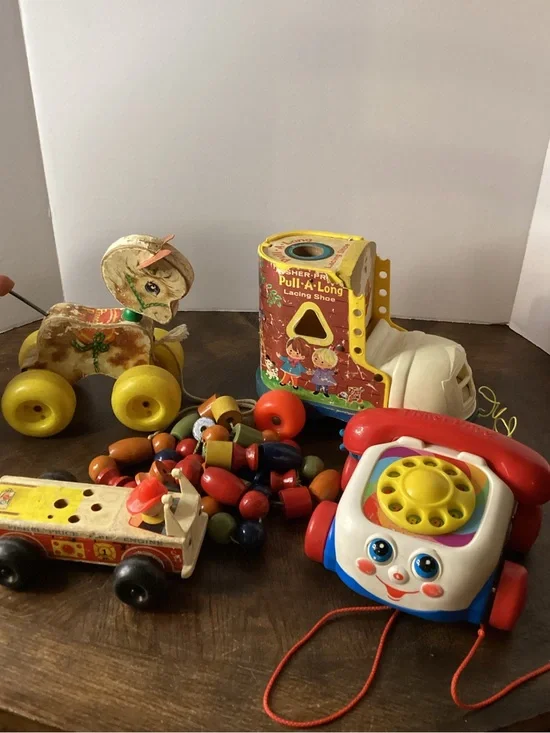 Various Fisher Price toys: Chatter Phone, Pull A Long Lacing Shoe, Fire Engine