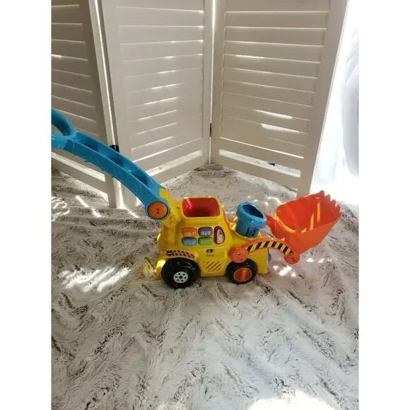 V TECH PUSH AND POP MUSICAL BULLDOZER
