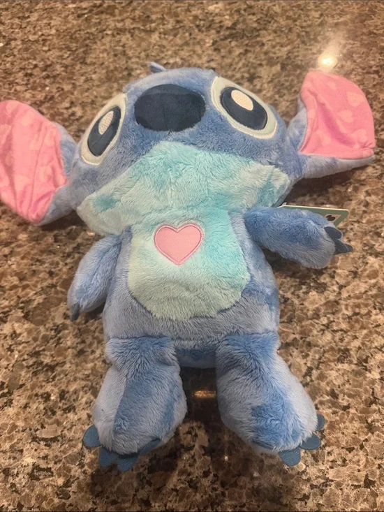 Disney Plush Character in Light Blue and Pink Accents