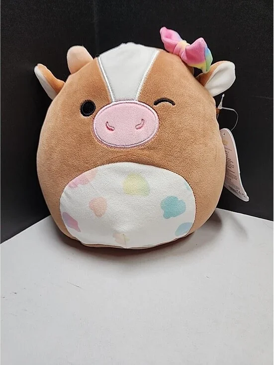 Squishmallows Griella the Winking Cow with Multi Color Bow Spots 7 Inch NEW NWT