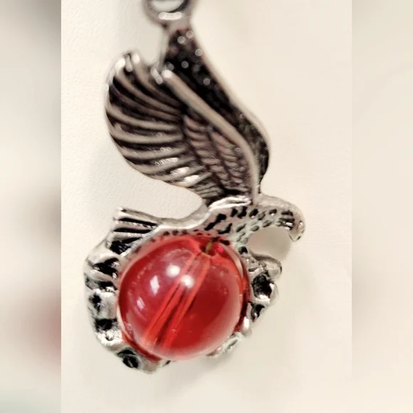 Necklace with Eagle holding a red  glass orb