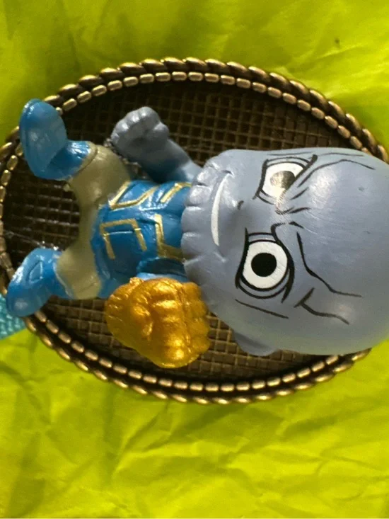 Blue Vinyl Character Figure with Gold Accent Bolo Tie