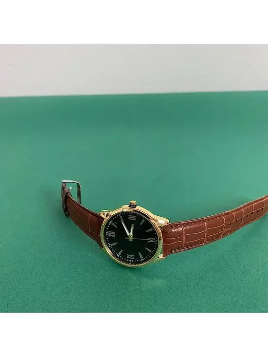 Minimalistic Black essential vintage style gold and leather style band watch. 9