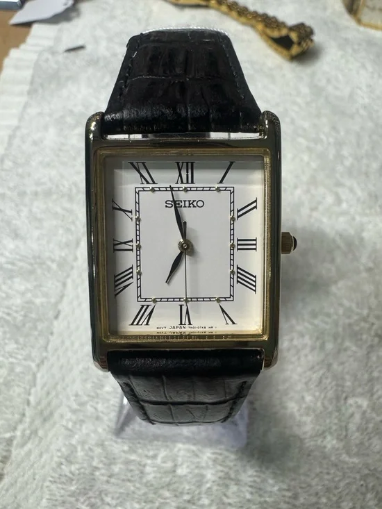 Seiko White Dial Watch with Black Strap and Gold Accents