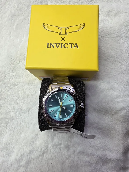 Invicta Men’s Silver Watch with Teal Dial and Yellow Accent 70051
