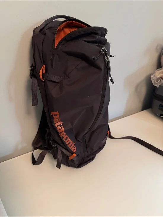 Patagonia Black Backpack with Orange Logo and Accents