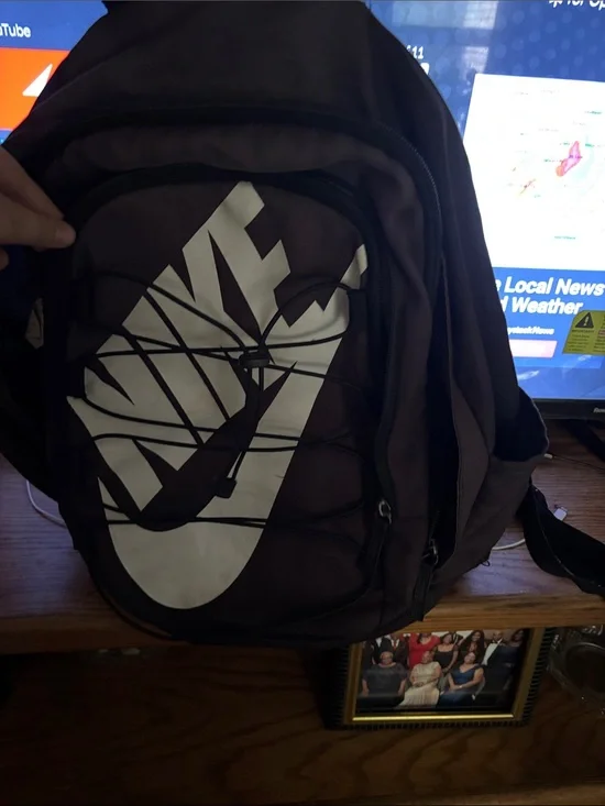 Nike Men's Black Backpack with White Logo and Front Bungee