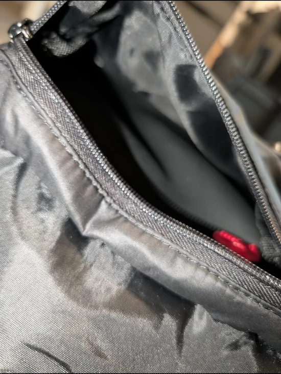 Herschel Supply Company Black Sling Bag with Red Accent Pull