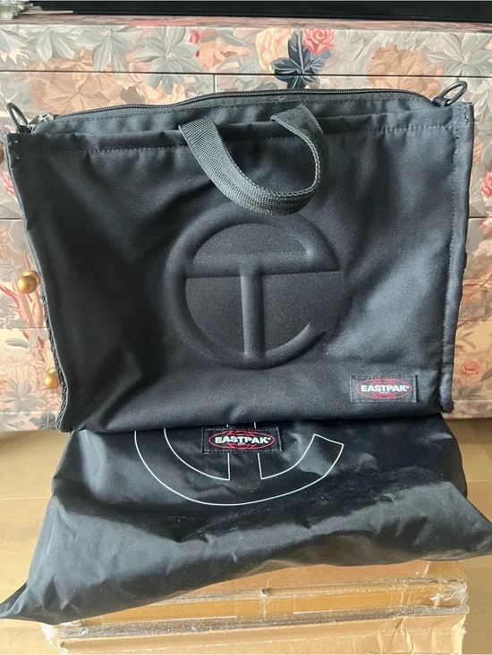 Eastpak Black Messenger backpack / Tote with Embossed Logo and dust bag