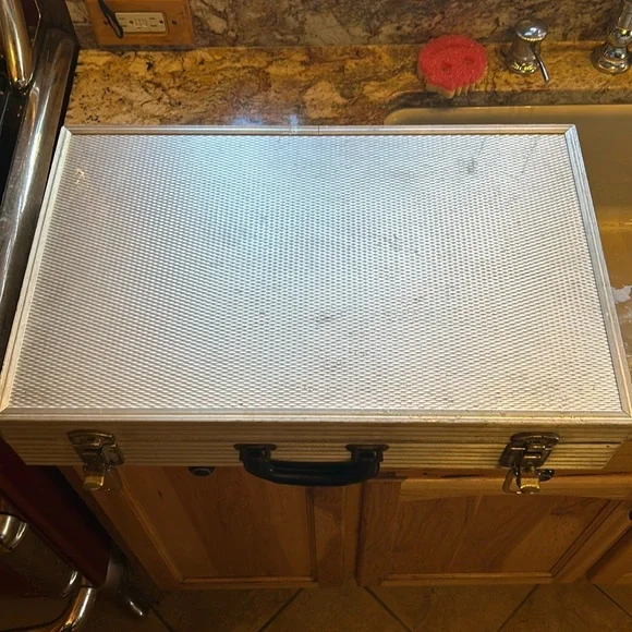 Aluminum padded case, handy for carrying anything; 24”long, 13.5”wide 4” deep