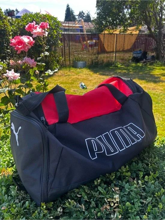 Puma Black Duffel Bag with Red Interior Accents Size 23”x10”x10”