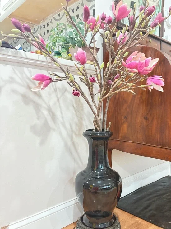 Magnolia Branches in Classic Black Ceramic Vase with cast iron base Home Accents