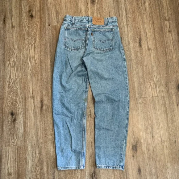 Vintage 80s Levi's 550 orange tab tapered leg denim jeans in light wash - 30x30‎