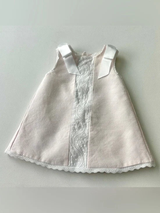 Dulces girl’s pique dress is classic Spanish-style heirloom garment.  Size 0-3M.